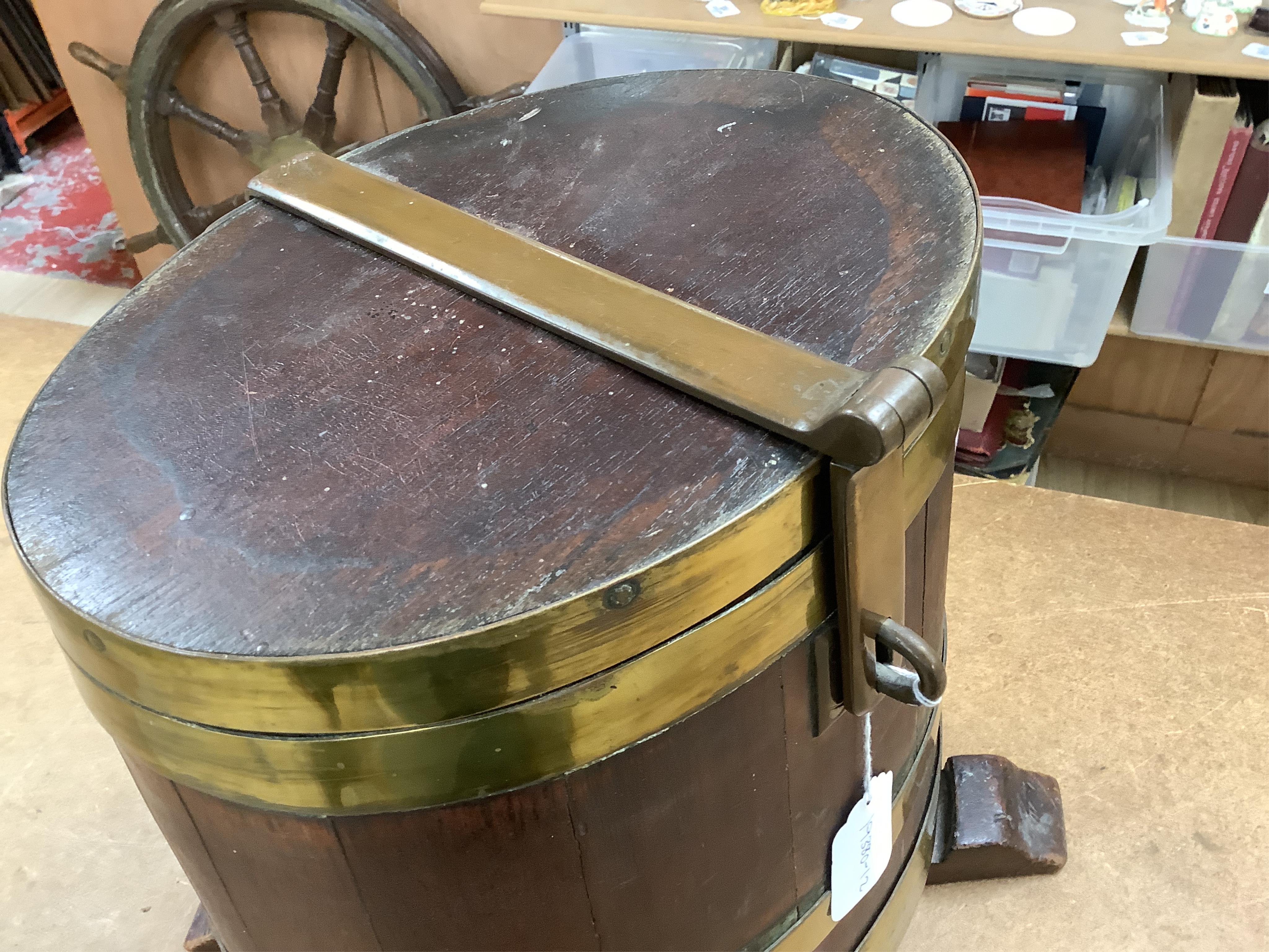 A 19th century teak and brass bound navy rum barrel on stand, 34cm high